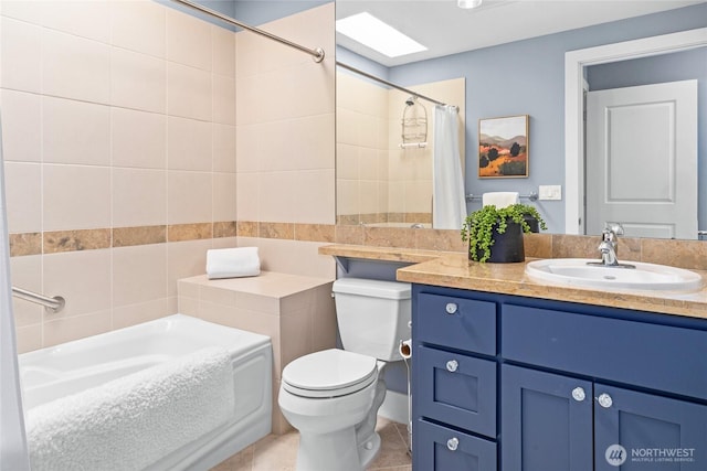 6801 Greenwood Ave N Unit 403, Seattle, WA 98103 - full bathroom featuring vanity, tile patterned flooring, and a skylight