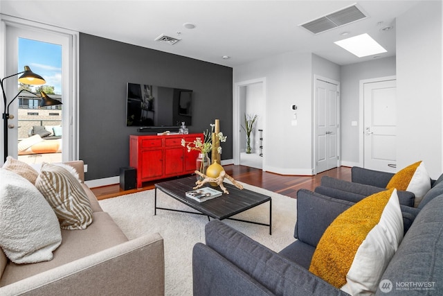 6801 Greenwood Ave N Unit 403, Seattle, WA 98103 - living room featuring wood finished floors and baseboards