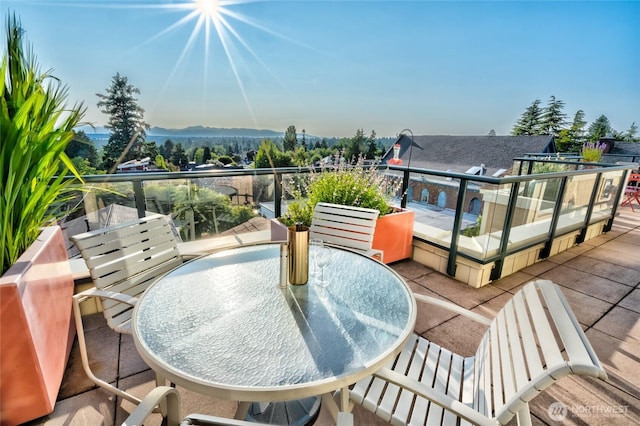 6801 Greenwood Ave N Unit 403, Seattle, WA 98103 - wooden terrace with a mountain view and outdoor dining space