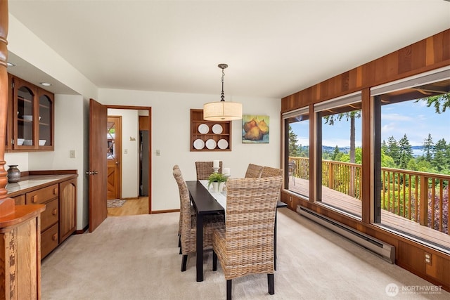 19212 94th Ave W, Edmonds, WA 98020 - dining space featuring a baseboard heating unit and light carpet