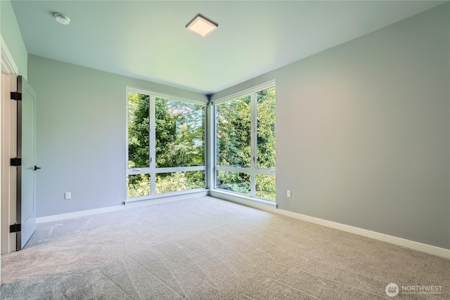 3540 S Graham St, Seattle, WA 98118 - carpeted spare room with a smoke detector and baseboards