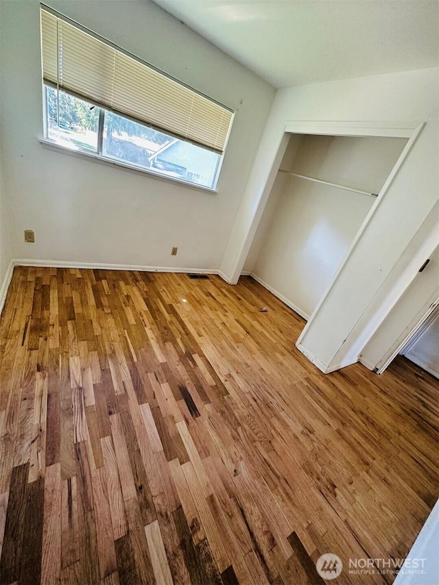 7702 202nd Pl SW, Edmonds, WA 98026 - unfurnished bedroom with wood finished floors and a closet