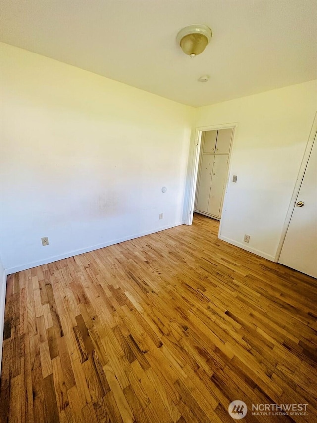 7702 202nd Pl SW, Edmonds, WA 98026 - empty room featuring wood-type flooring and baseboards