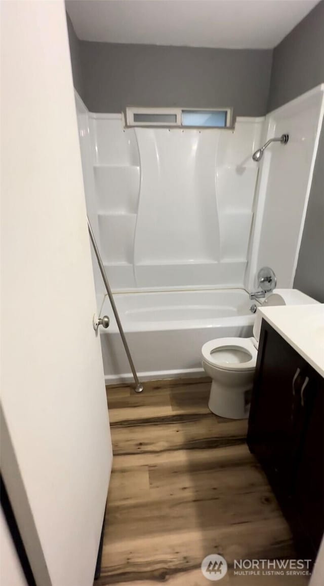 7702 202nd Pl SW, Edmonds, WA 98026 - bathroom with vanity, wood finished floors, and tub / shower combination