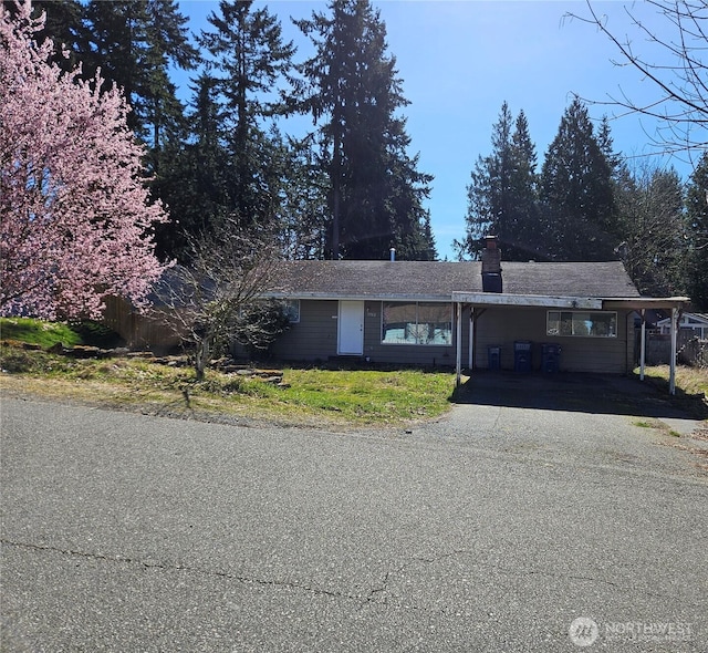 7702 202nd Pl SW, Edmonds, WA 98026 - single story home featuring driveway, a carport, and a chimney