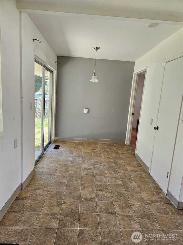 7702 202nd Pl SW, Edmonds, WA 98026 - unfurnished dining area featuring baseboards