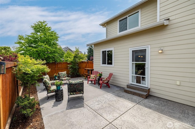 3885 Summersun St, Mount Vernon, WA 98273 - fenced backyard featuring outdoor lounge area, a patio area, and entry steps