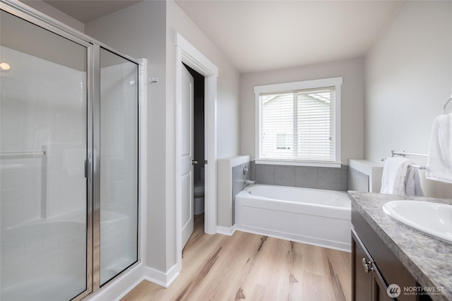 3885 Summersun St, Mount Vernon, WA 98273 - full bath with wood finished floors, a garden tub, a stall shower, and vanity