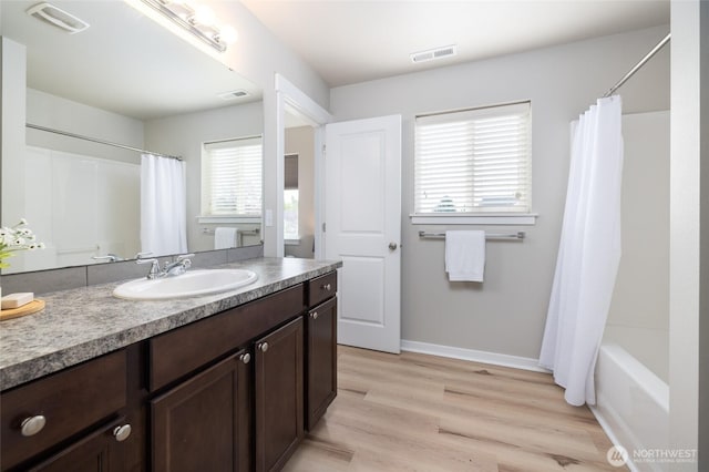 3885 Summersun St, Mount Vernon, WA 98273 - full bathroom with vanity, wood finished floors, and shower / tub combo