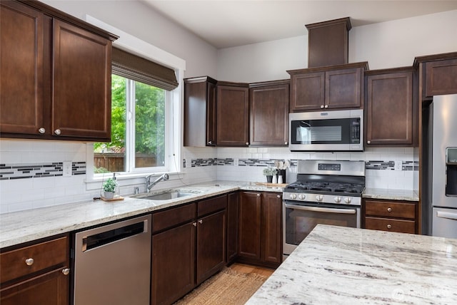 3885 Summersun St, Mount Vernon, WA 98273 - kitchen with appliances with stainless steel finishes, light stone counters, and backsplash