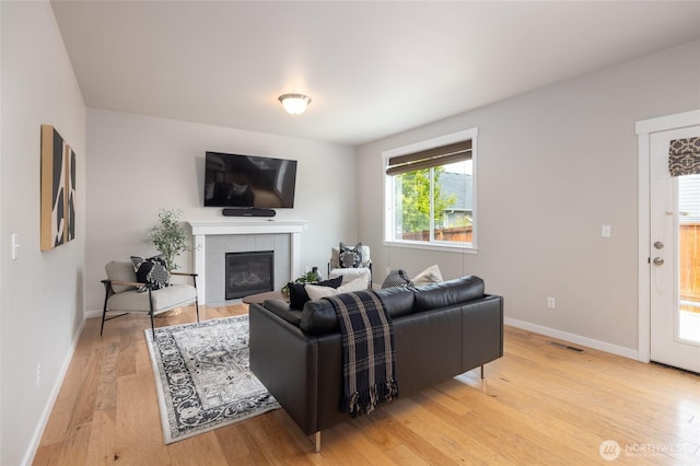 3885 Summersun St, Mount Vernon, WA 98273 - living area with light wood-style floors and a fireplace