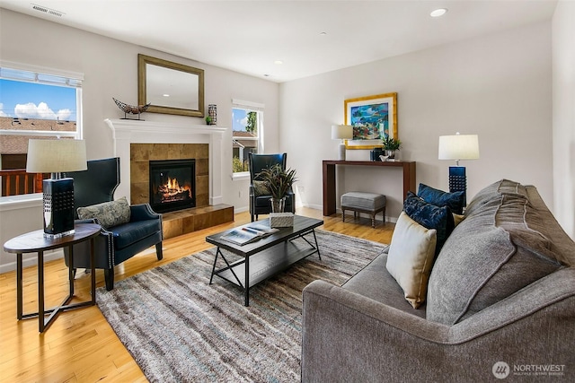 7649 NE 196th St, Kenmore, WA 98028 - living area with wood finished floors, a fireplace, and recessed lighting