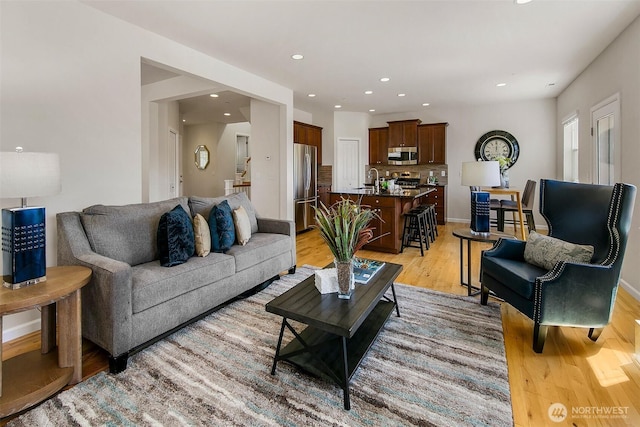 7649 NE 196th St, Kenmore, WA 98028 - living area featuring light wood-style flooring and recessed lighting