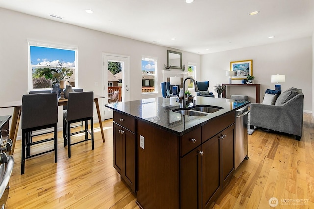 7649 NE 196th St, Kenmore, WA 98028 - kitchen featuring open floor plan, light wood-style flooring, recessed lighting, and dark brown cabinetry