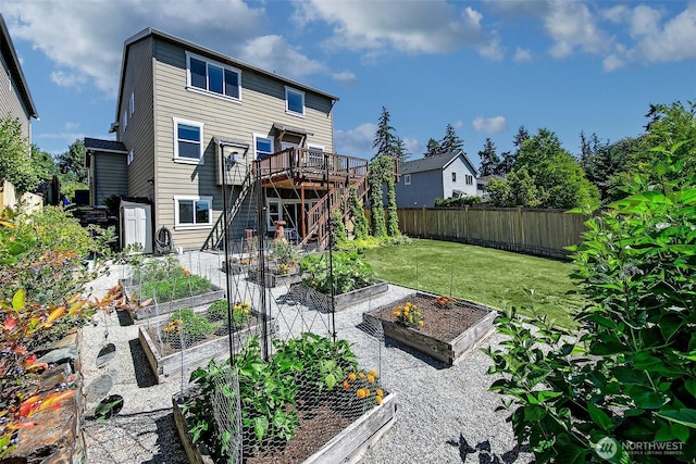 7649 NE 196th St, Kenmore, WA 98028 - back of house with stairs, a garden, and a deck