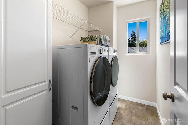 7649 NE 196th St, Kenmore, WA 98028 - washroom featuring washer and clothes dryer and baseboards