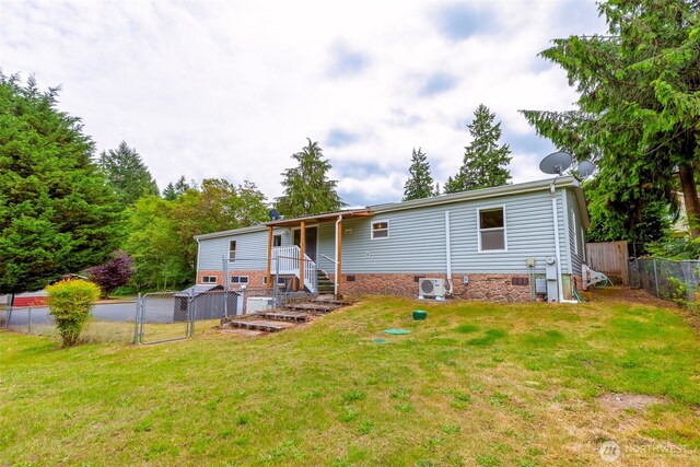 889 NE Sleepy Way, Bremerton, WA 98311 - rear view of house with a fenced backyard and a gate