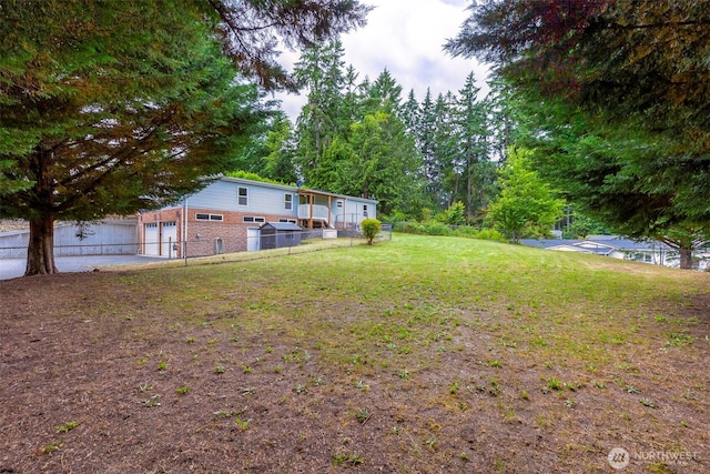 889 NE Sleepy Way, Bremerton, WA 98311 - view of yard featuring a garage and driveway