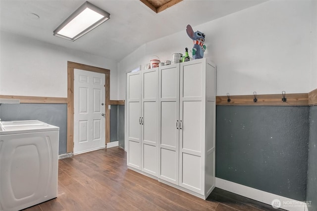 524 Brown St SE, Orting, WA 98360 - laundry room featuring wood finished floors and cabinet space