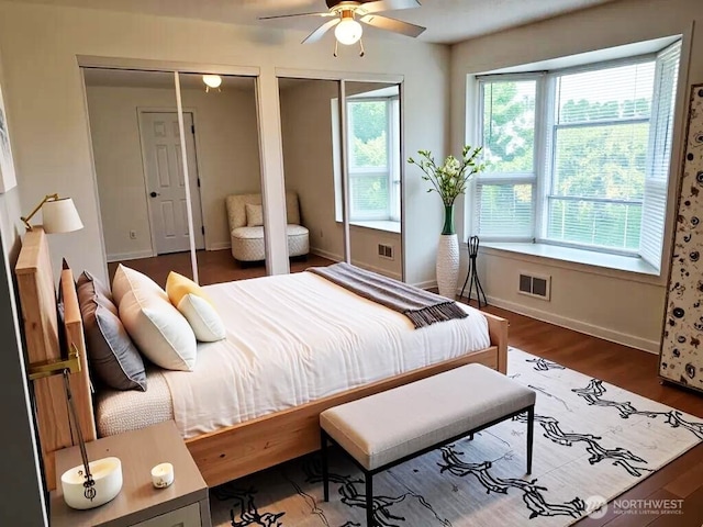 301 Norman St, Sequim, WA 98382 - bedroom featuring multiple closets and wood finished floors
