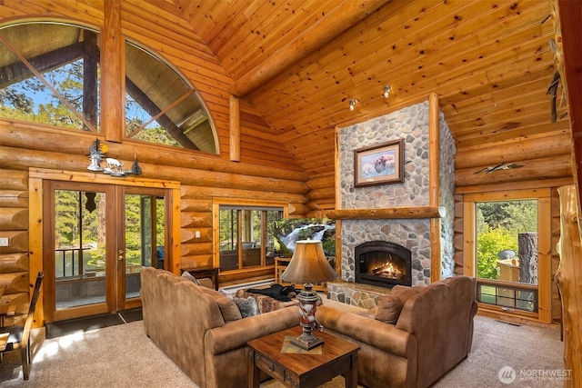 197 Swiftwater Ln, Leavenworth, WA 98826 - carpeted living area with high vaulted ceiling, rustic walls, a fireplace, french doors, and wooden ceiling