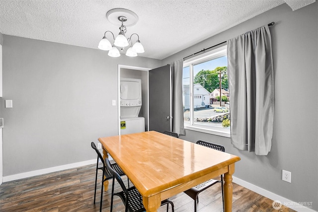 1612 33rd St Unit 102, Everett, WA 98201 - dining area with stacked washer and clothes dryer, a textured ceiling, a chandelier, and dark wood finished floors