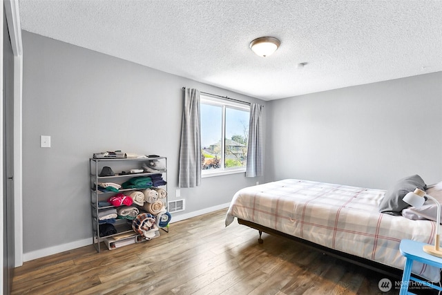 1612 33rd St Unit 102, Everett, WA 98201 - bedroom with wood finished floors and a textured ceiling