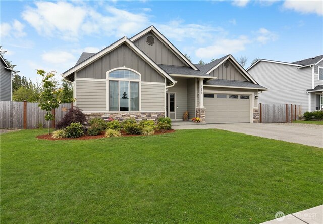225 N Mcneely St, Buckley, WA 98321 - craftsman-style home featuring board and batten siding, stone siding, driveway, and a garage