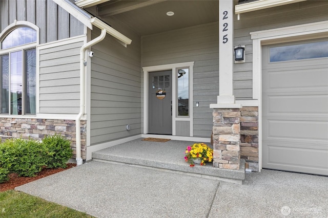 225 N Mcneely St, Buckley, WA 98321 - view of exterior entry featuring stone siding and an attached garage
