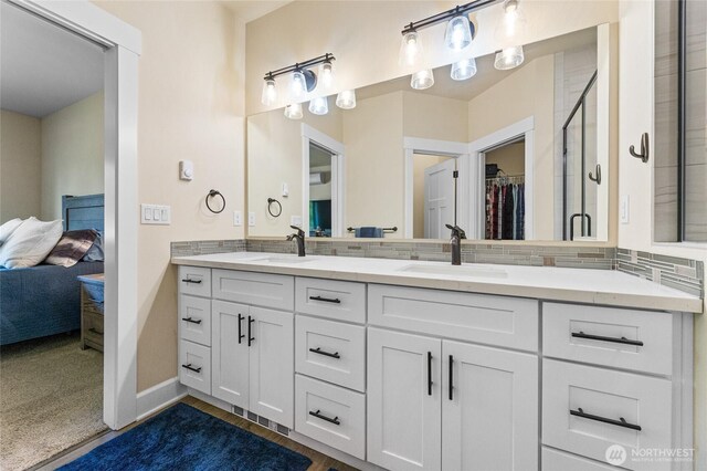 225 N Mcneely St, Buckley, WA 98321 - full bath with ensuite bathroom, double vanity, a spacious closet, and a shower with shower door