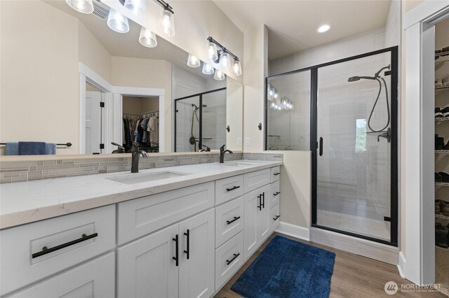 225 N Mcneely St, Buckley, WA 98321 - bathroom featuring a spacious closet, double vanity, a shower stall, and recessed lighting