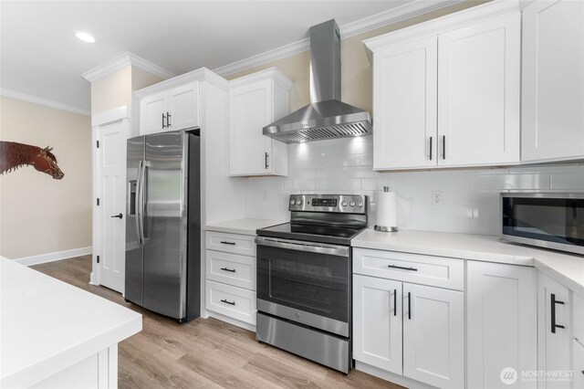 225 N Mcneely St, Buckley, WA 98321 - kitchen with appliances with stainless steel finishes, wall chimney exhaust hood, crown molding, light countertops, and tasteful backsplash