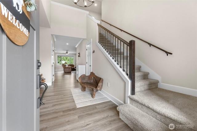 225 N Mcneely St, Buckley, WA 98321 - foyer entrance with stairs, wood finished floors, and a high ceiling