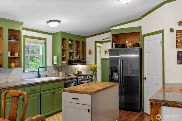 12543 Bear Track Ln SW, Port Orchard, WA 98367 - kitchen featuring open shelves, appliances with stainless steel finishes, butcher block countertops, backsplash, and vaulted ceiling