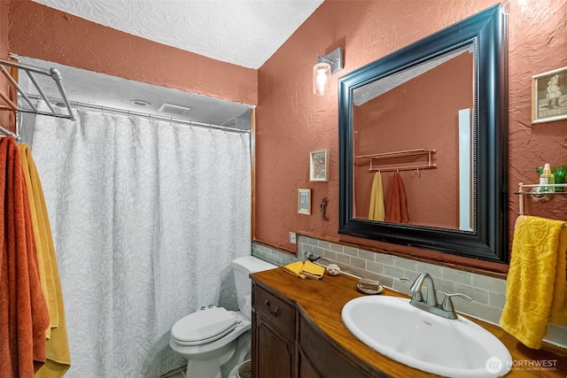 12543 Bear Track Ln SW, Port Orchard, WA 98367 - full bathroom with a textured wall, vanity, decorative backsplash, and a shower with curtain
