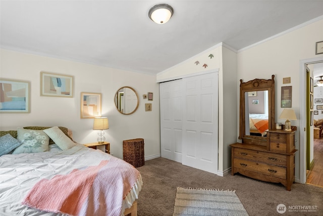 12543 Bear Track Ln SW, Port Orchard, WA 98367 - bedroom with vaulted ceiling, a closet, carpet, and crown molding