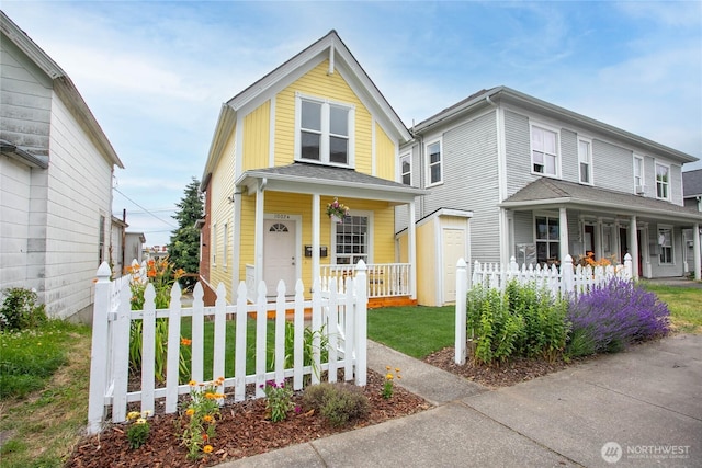 1007 N Forest St, Bellingham, WA 98225 - view of front of property with covered porch and a fenced front yard