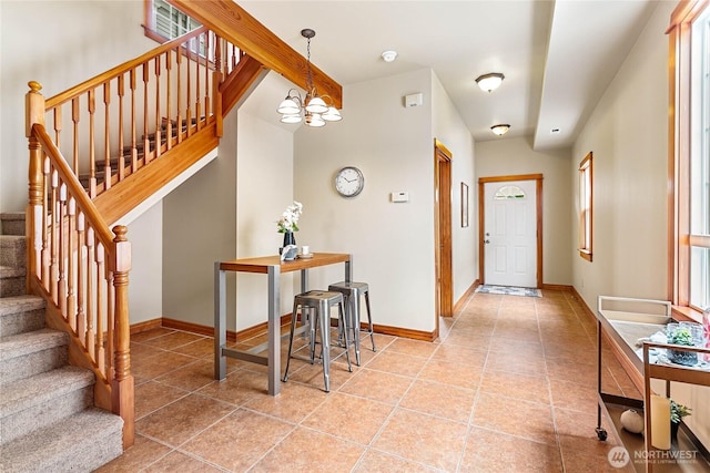 1007 N Forest St, Bellingham, WA 98225 - tiled entryway with stairway and a chandelier