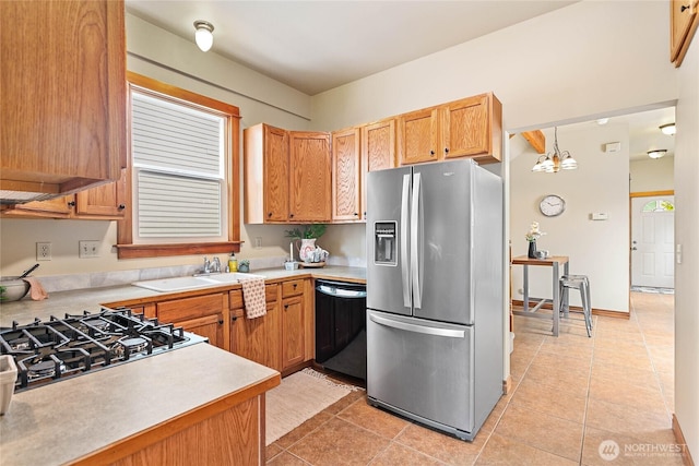 1007 N Forest St, Bellingham, WA 98225 - kitchen with stainless steel fridge, dishwasher, light countertops, and light tile patterned floors