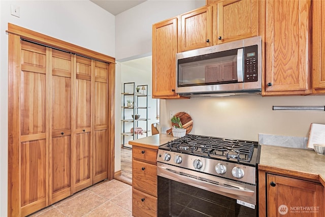 1007 N Forest St, Bellingham, WA 98225 - kitchen with stainless steel appliances, light countertops, and light tile patterned floors