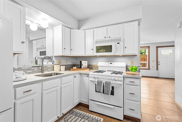 1007 N Forest St, Bellingham, WA 98225 - kitchen featuring white appliances, light tile patterned floors, white cabinets, and light countertops