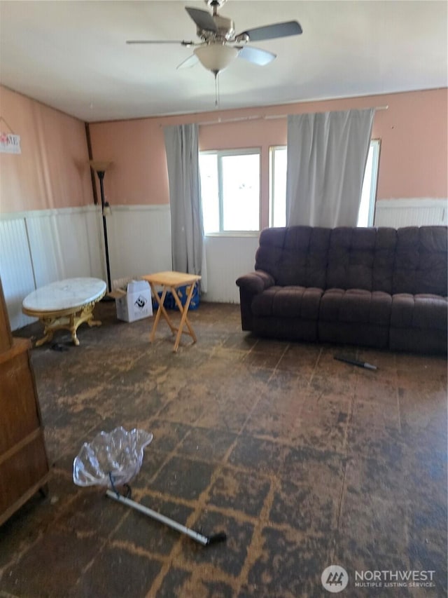 111 99th St S Unit 14, Tacoma, WA 98444 - living area featuring a wainscoted wall and ceiling fan