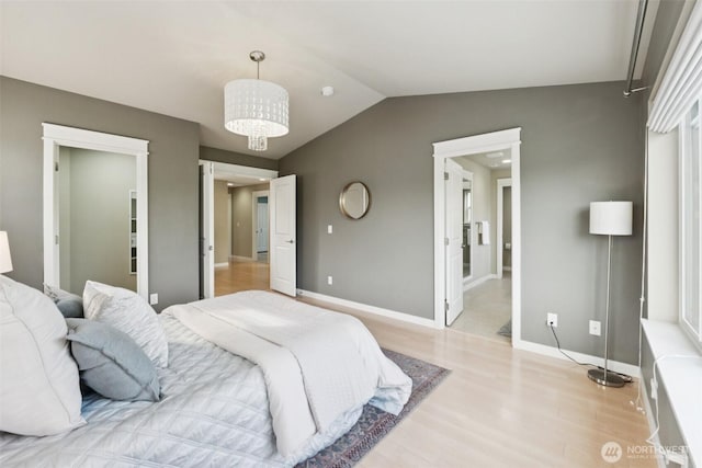 20402 1st Pl W, Lynnwood, WA 98036 - bedroom featuring light wood-type flooring and lofted ceiling