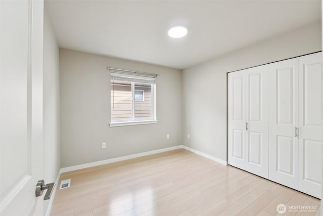 20402 1st Pl W, Lynnwood, WA 98036 - unfurnished bedroom with light wood finished floors and a closet