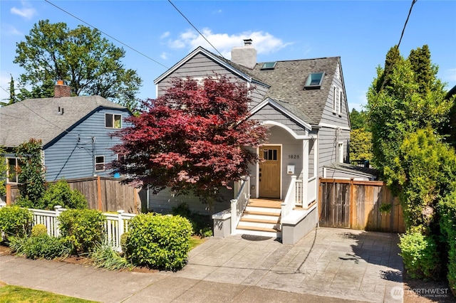 1628 27th Ave, Seattle, WA 98122 - view of front facade featuring a shingled roof and a chimney
