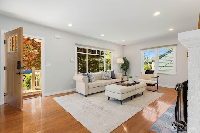 1628 27th Ave, Seattle, WA 98122 - living area with light wood-style flooring, plenty of natural light, and recessed lighting