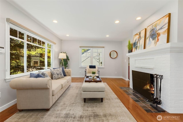 1628 27th Ave, Seattle, WA 98122 - living room featuring wood finished floors, a brick fireplace, and recessed lighting