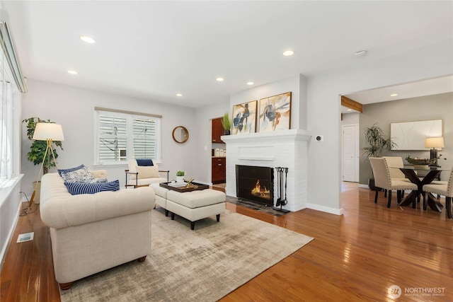 1628 27th Ave, Seattle, WA 98122 - living room with wood finished floors, recessed lighting, and a fireplace