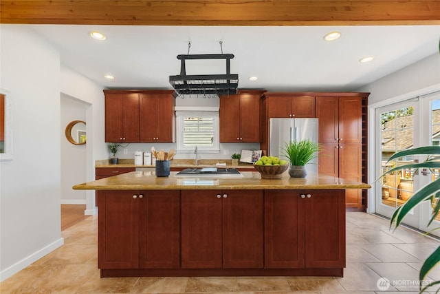 1628 27th Ave, Seattle, WA 98122 - kitchen featuring stainless steel appliances, recessed lighting, healthy amount of natural light, and light stone countertops