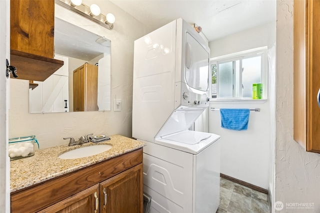 9317 214th Ave E, Bonney Lake, WA 98391 - bathroom featuring stacked washer and clothes dryer and vanity